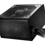 Black PC power supply unit with a textured top vent and braided cables extending from the side.