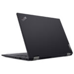 Dark gray ThinkPad laptop closed, viewed from rear-left with Lenovo logo on the lid