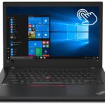 Lenovo ThinkPad laptop open with Windows 10 desktop and a large touch gesture icon on the screen.